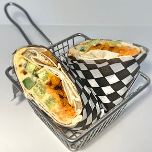 Veggie wrap, hummus, tomato, carrot, sweet potato and carrot in a pita wrap. Freshly made, Kosher and vegan in Ottawa